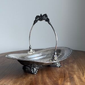 * SOLD * Vintage Pairpoint silver plated basket with an ornate swing handle